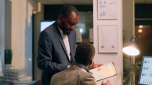 Business owner analyzing financial reports to prepare an exit strategy.