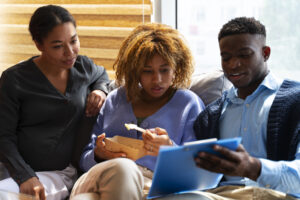 Co-founders reviewing financial reports together to prevent future disputes.