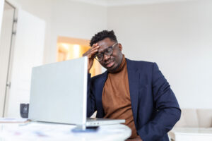Entrepreneur stressed over financial spreadsheets and projections