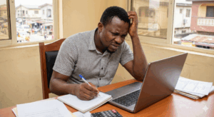 Nigerian entrepreneur learning how to track business income and expenses